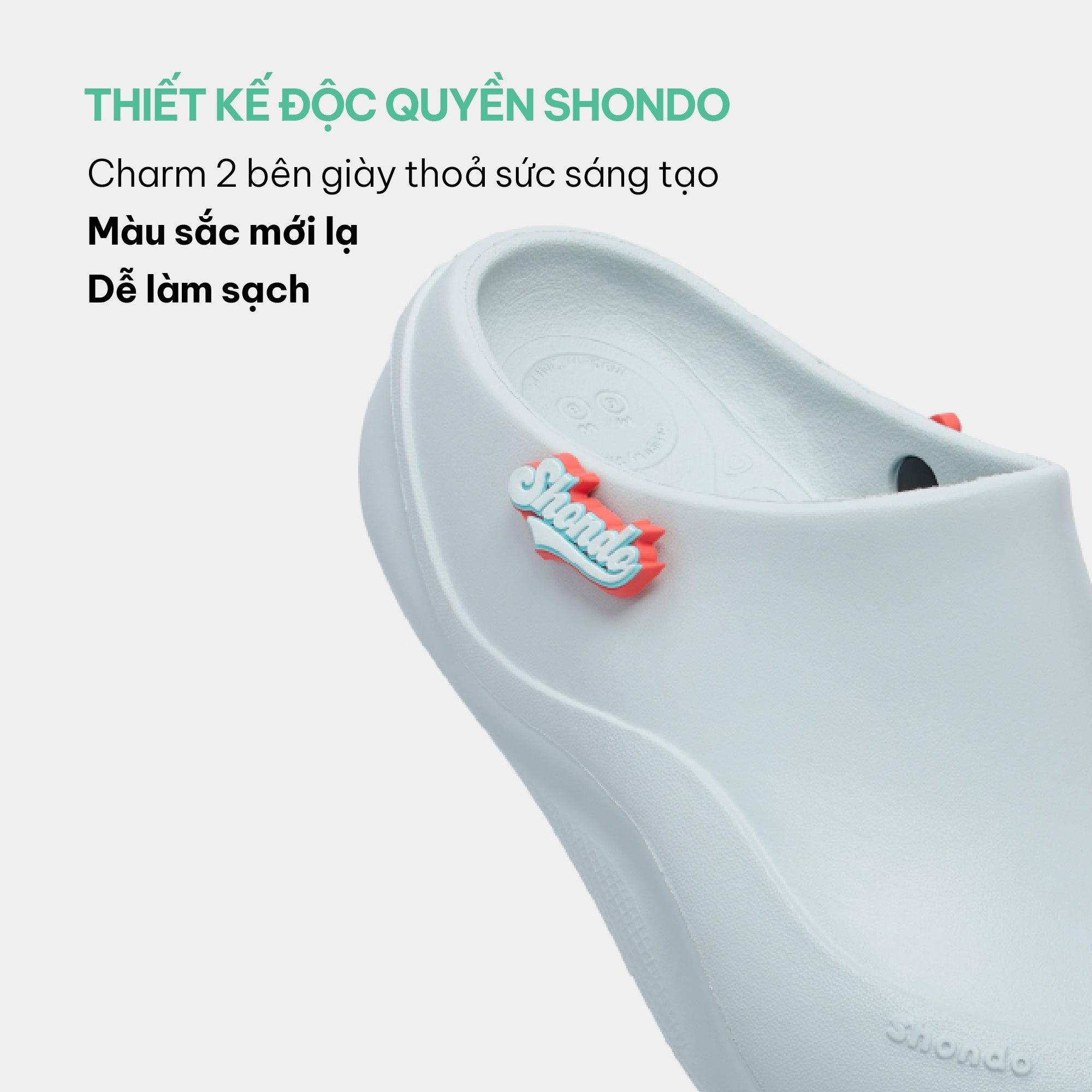 Clog Suke nữ nhựa đúc gắn charm xanh trời